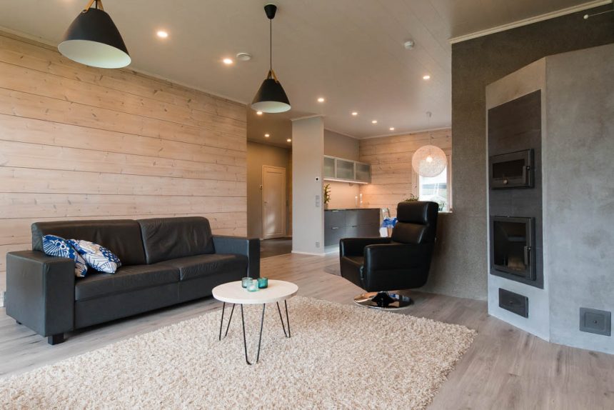 Living Room With A Chimney In A Cosy Wooden Cottage By Rovaniemi